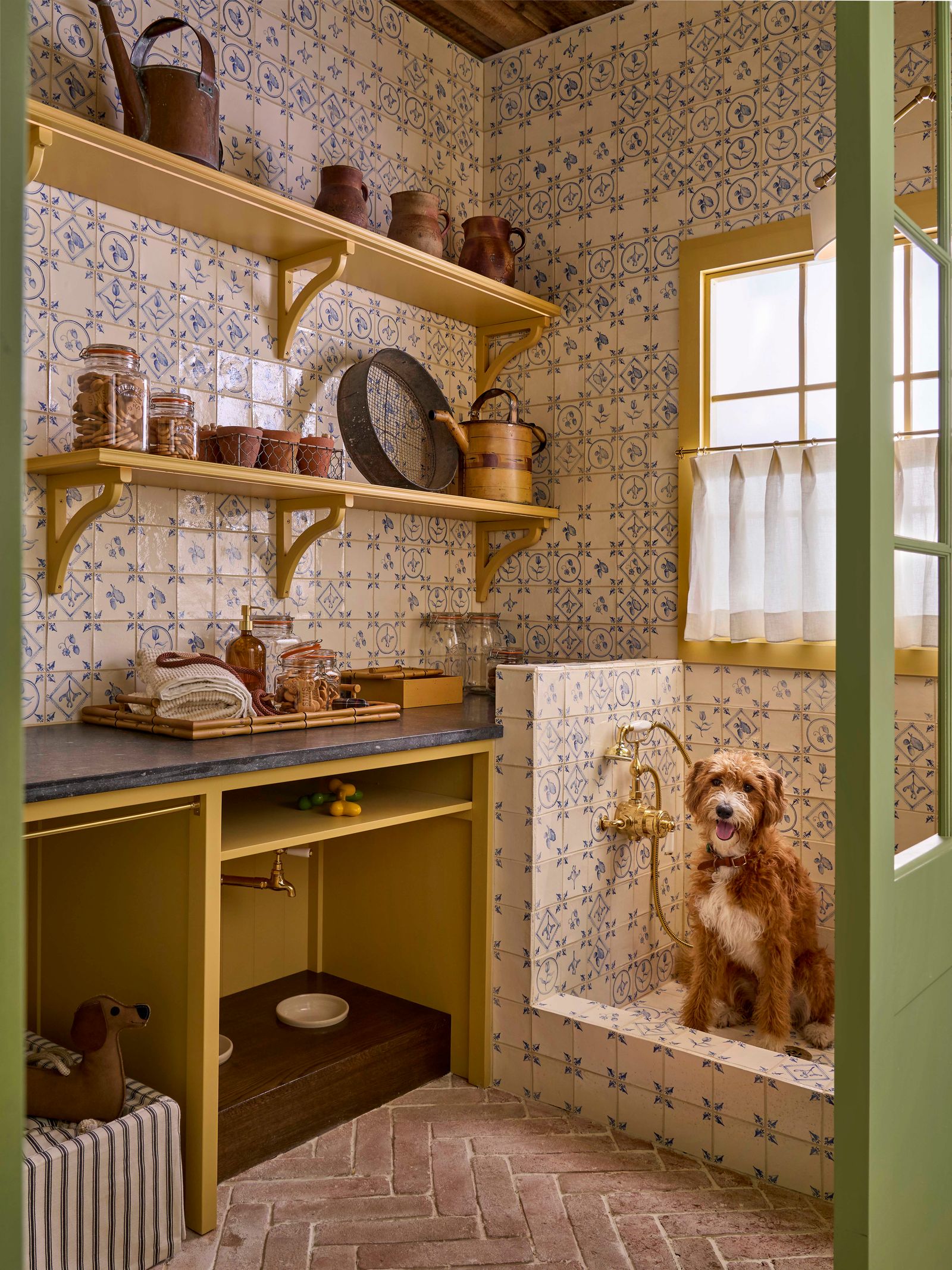 Image may contain Indoors Interior Design Animal Canine Dog Mammal Pet Floor Shelf Box Clothing and Footwear