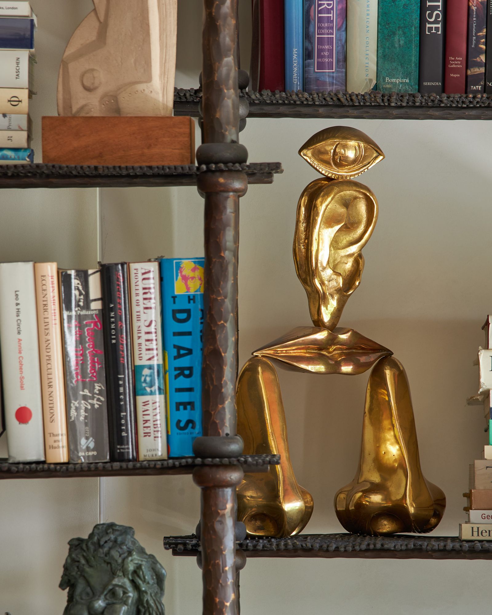 Image may contain Shelf Furniture Bookcase Adult Person and Wedding