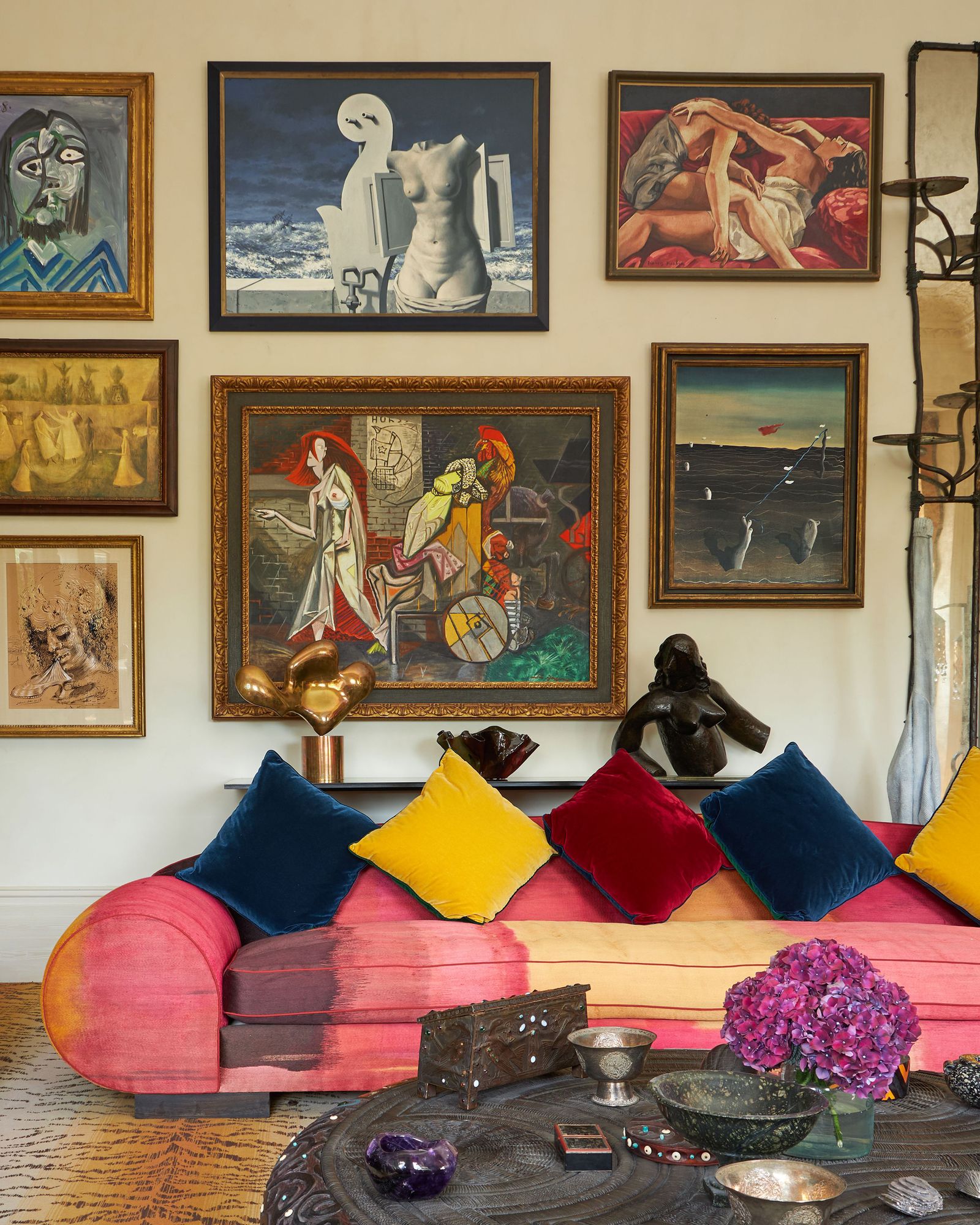 Image may contain Cushion Home Decor Art Painting Couch Furniture Adult Person Animal Canine Dog Mammal and Pet