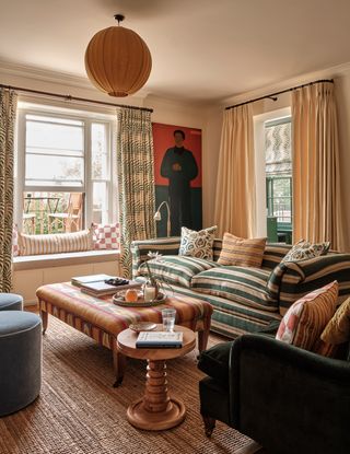 Image may contain Home Decor Cup Book Publication Lamp Couch Furniture Adult Person Chair Rug Plate and Bread