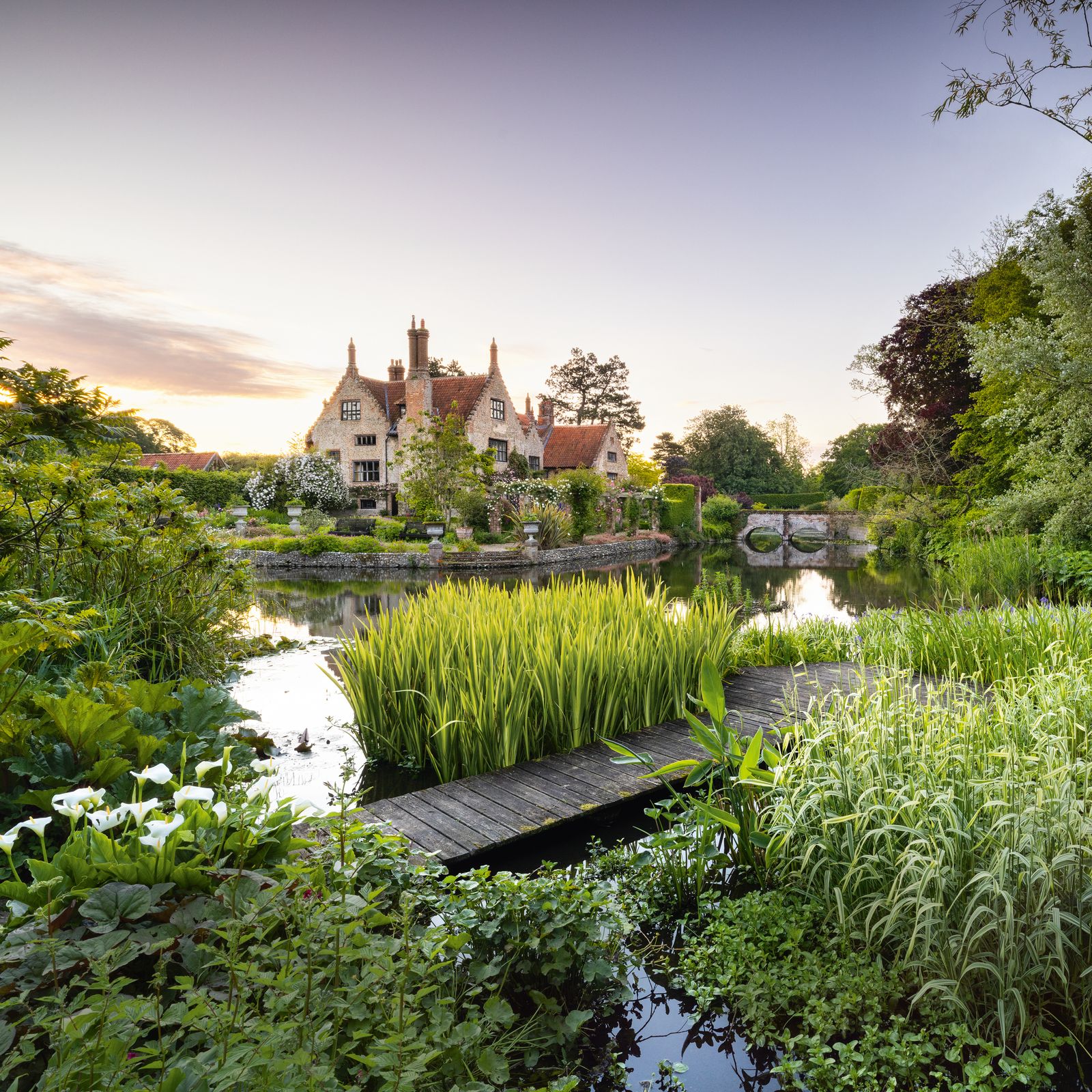 The romantic moated garden of a 16th-century manor house in Norfolk