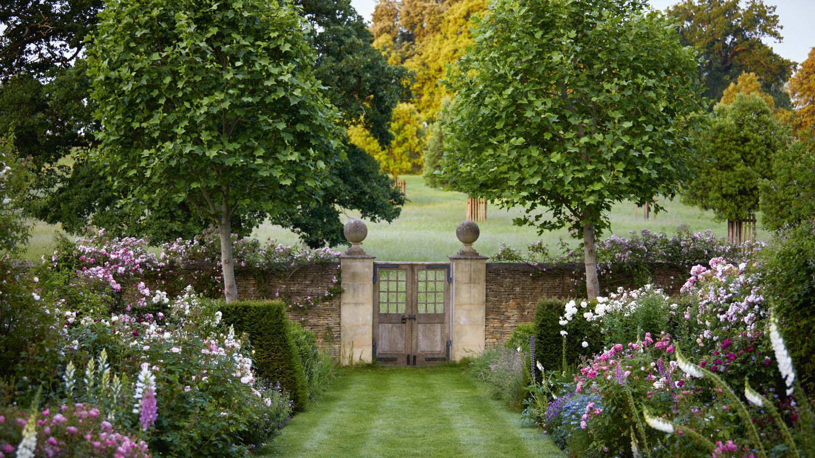 A duchess' picturesque Cotswold cottage garden filled with a riot of flowers