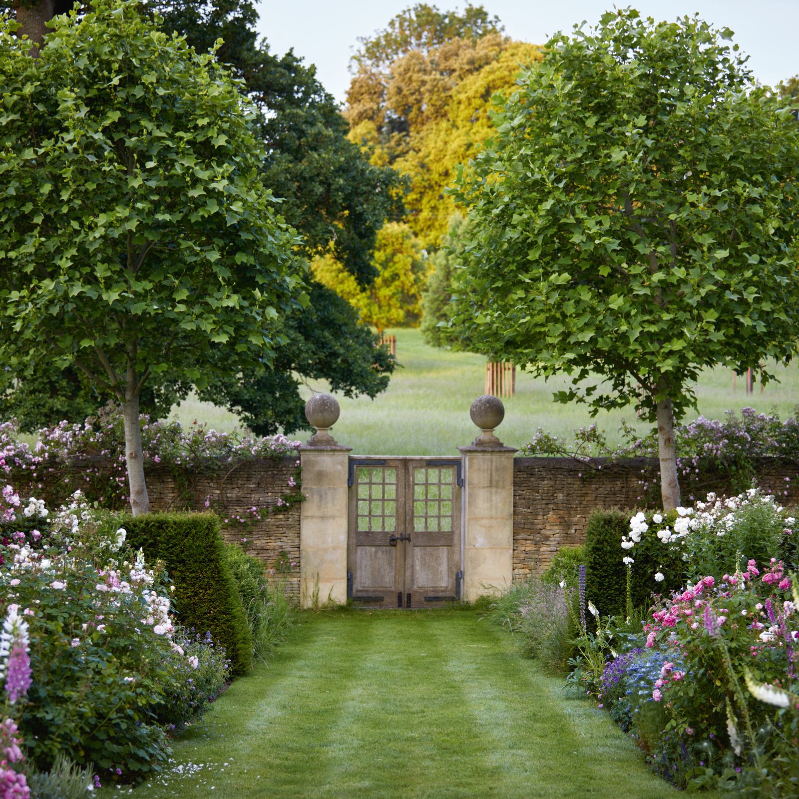 A duchess' picturesque Cotswold cottage garden filled with a riot of flowers